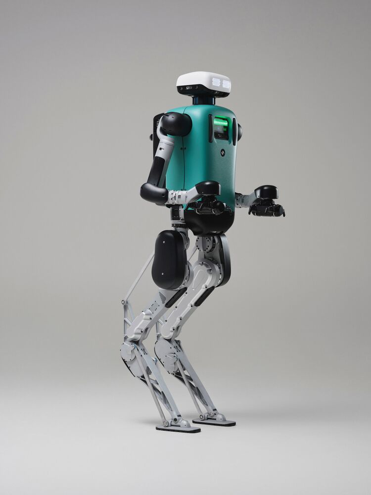 An agility humanoid robot with legs. The knees of the robot face backwards. 