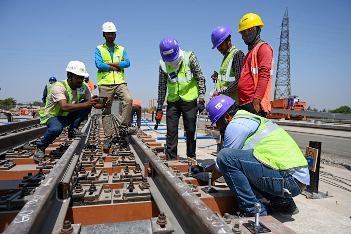 Workers on a bullet train line in Surat, India