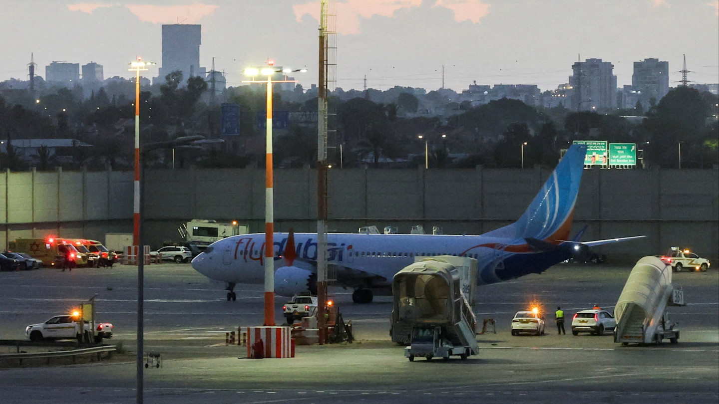 A plane, carrying passengers who were on the Flydubai aircraft bound for Israel from the United Arab Emirates, which was diverted to Saudi Arabia following an emergency signal, on the tarmac as it arrives at the Ben Gurion International Airport, in Lod, near Tel Aviv, Israel