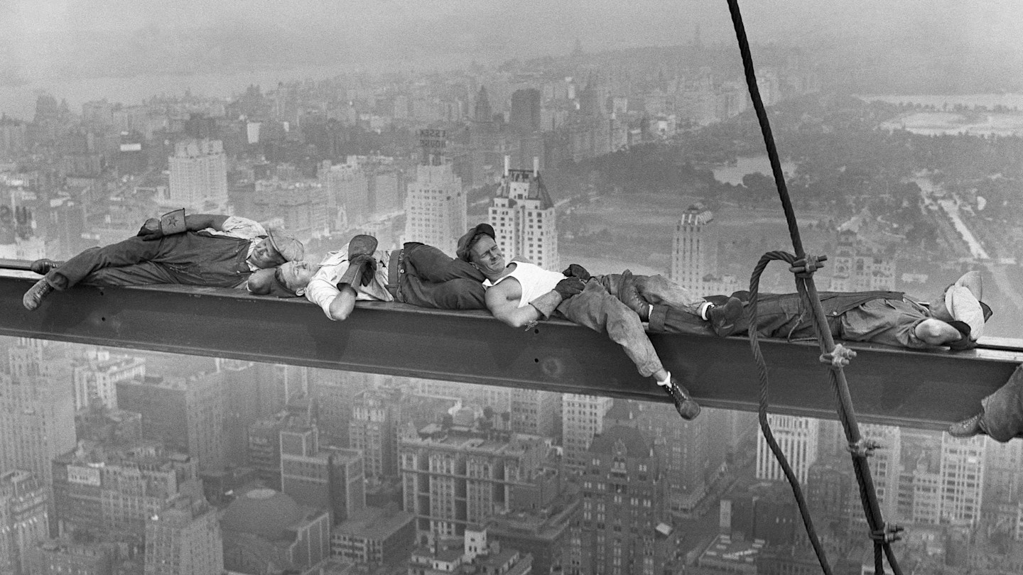 Joseph Eckner, at left, and Joe Curtis, second from right in an undershirt, nap on a steel girder with two other workers high above Manhattan.