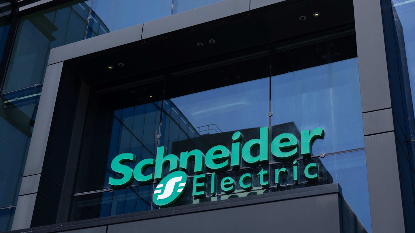 Schneider Electric logo on the company’s glass headquarters building in Rueil-Malmaison, near Paris.
