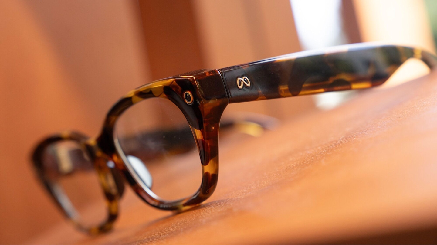 Close-up of Meta Capri smart glasses with a tortoise-shell frame, showing the Meta logo.
