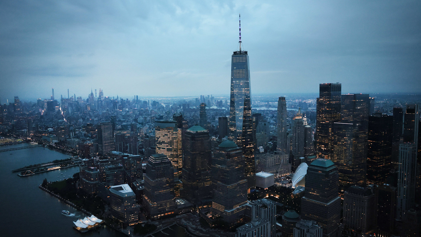 Lower Manhattan skyline at dusk with One World Trade Center illuminated, seen ahead of the 25th anniversary of September 11.