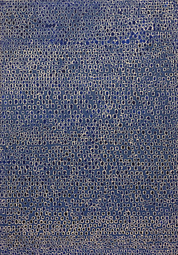 An abstract painting by Whanki Kim featuring a dense pattern of small, irregular, light-colored oval and rectangular shapes on a blue background.