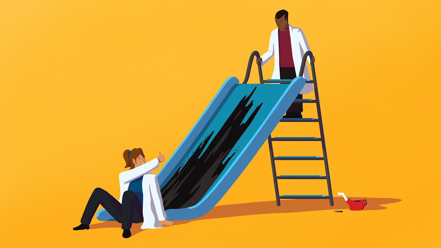 An illustration showing two researchers in lab coats testing lubricants on a playground slide, one giving a thumbs up at the bottom while the other stands at the top. A lubricant container is on the ground nearby.
