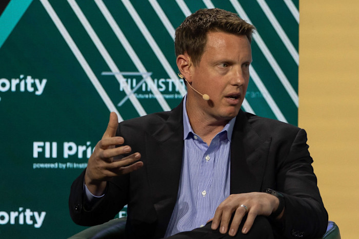 David Ellison speaks while gesturing with his hand.