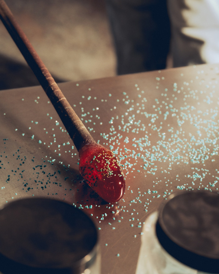 Textured flecks are added to the glass