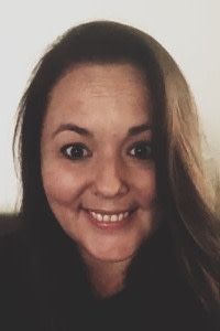 Sarah-Jane Davies smiles at the camera.