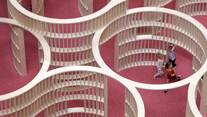Aerial view of children playing in a metal maze