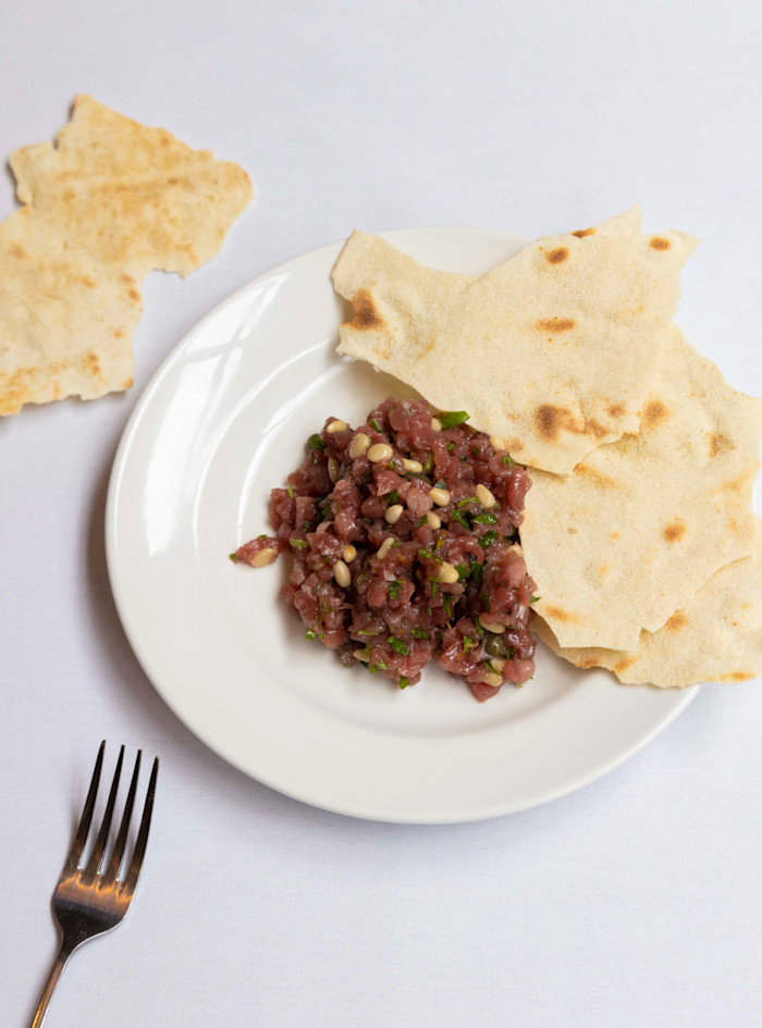Tuna tartare with orange, pine nuts and pane carasau served at Boca di Lupo