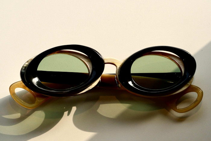 A pair of glasses with frames made of three different materials.
