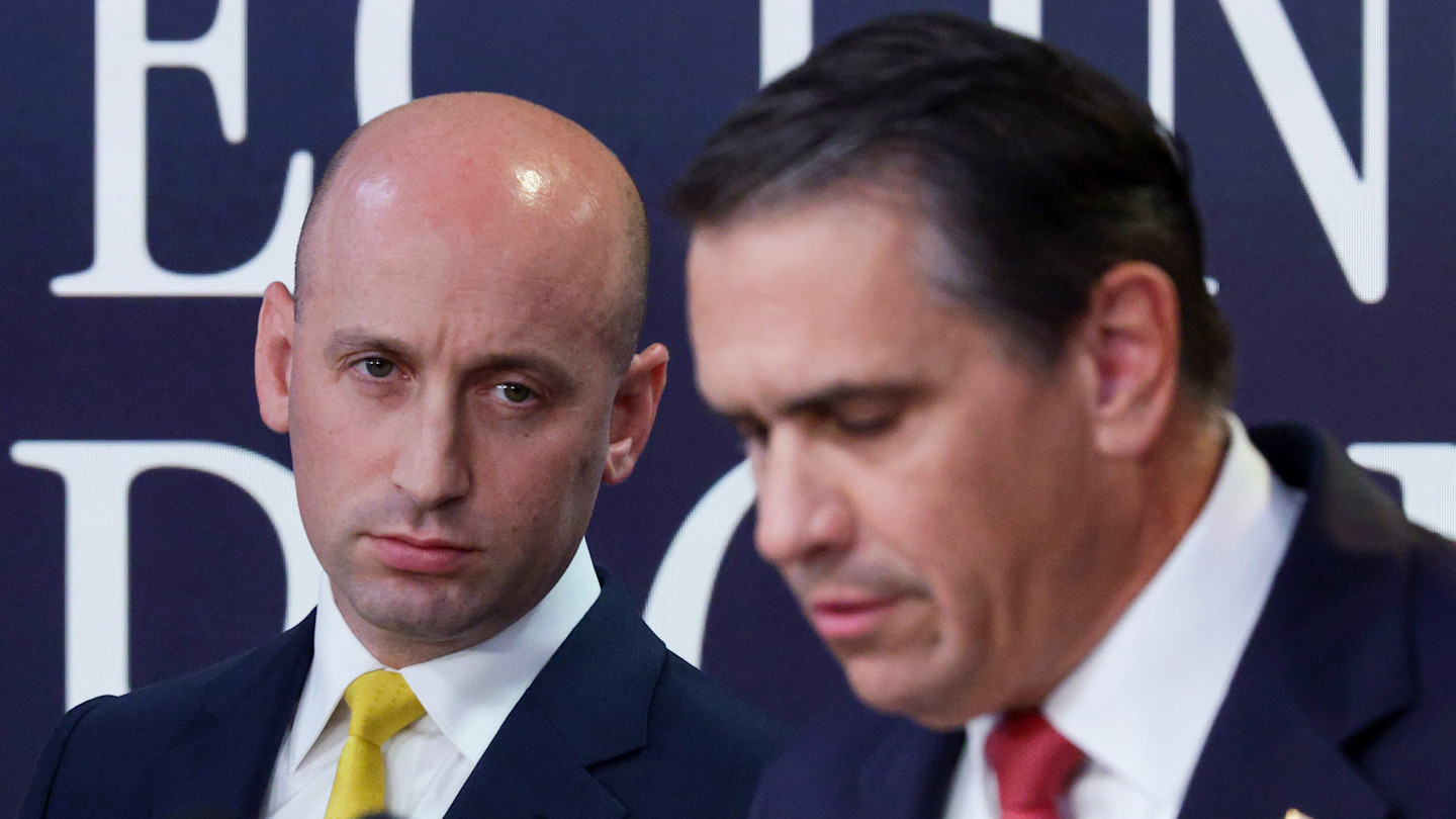 Stephen Miller looks on as Todd Blanche speaks during a press conference about H-1B and PERM program fraud findings.