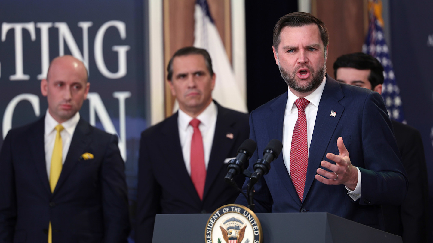 Vice-president JD Vance speaks at a podium as Stephen Miller and attorney-general Todd Blanche listen during a news conference