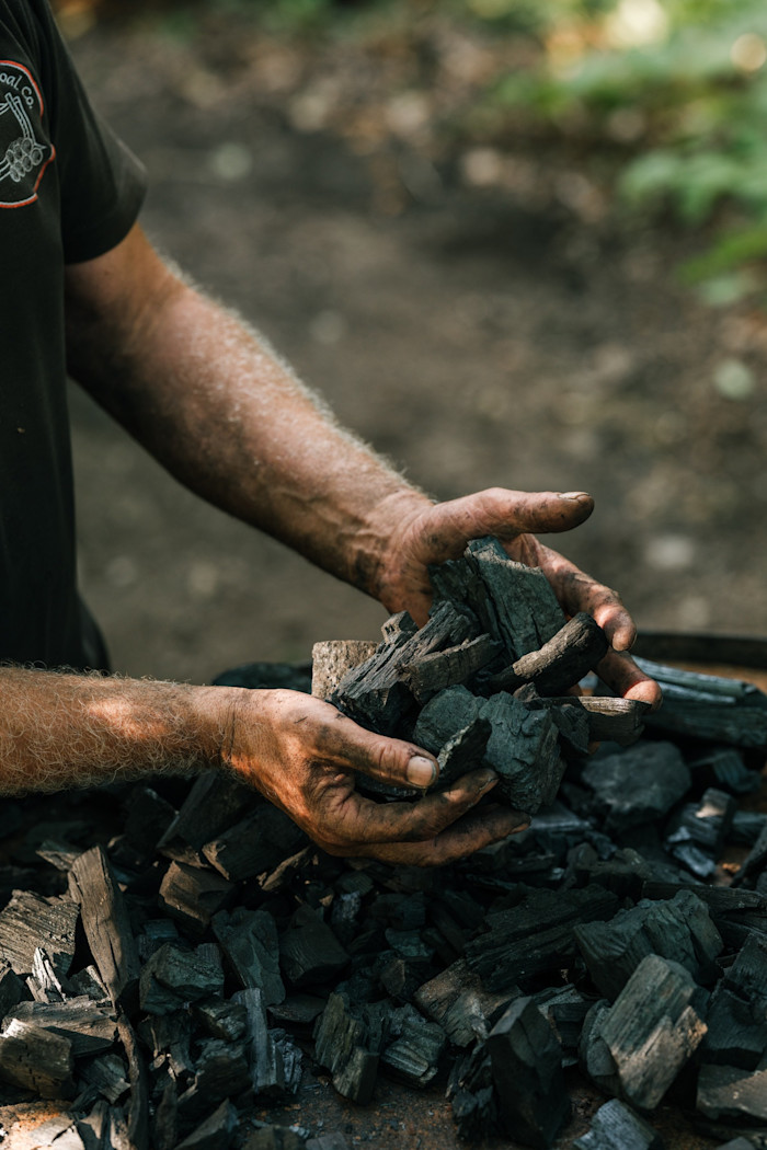 Bettle with charcoal for his kiln