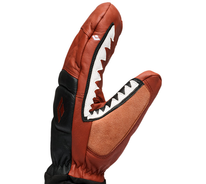 A red leather ski mitten with black panels and white zigzag detailing.