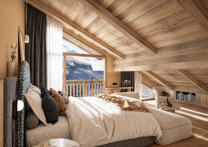 A cosy hotel room with sloped wooden ceilings, a large bed with multiple pillows and a window showing snowy mountains outside