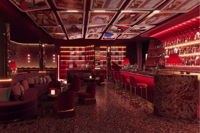 A dark hotel bar with red lighting 