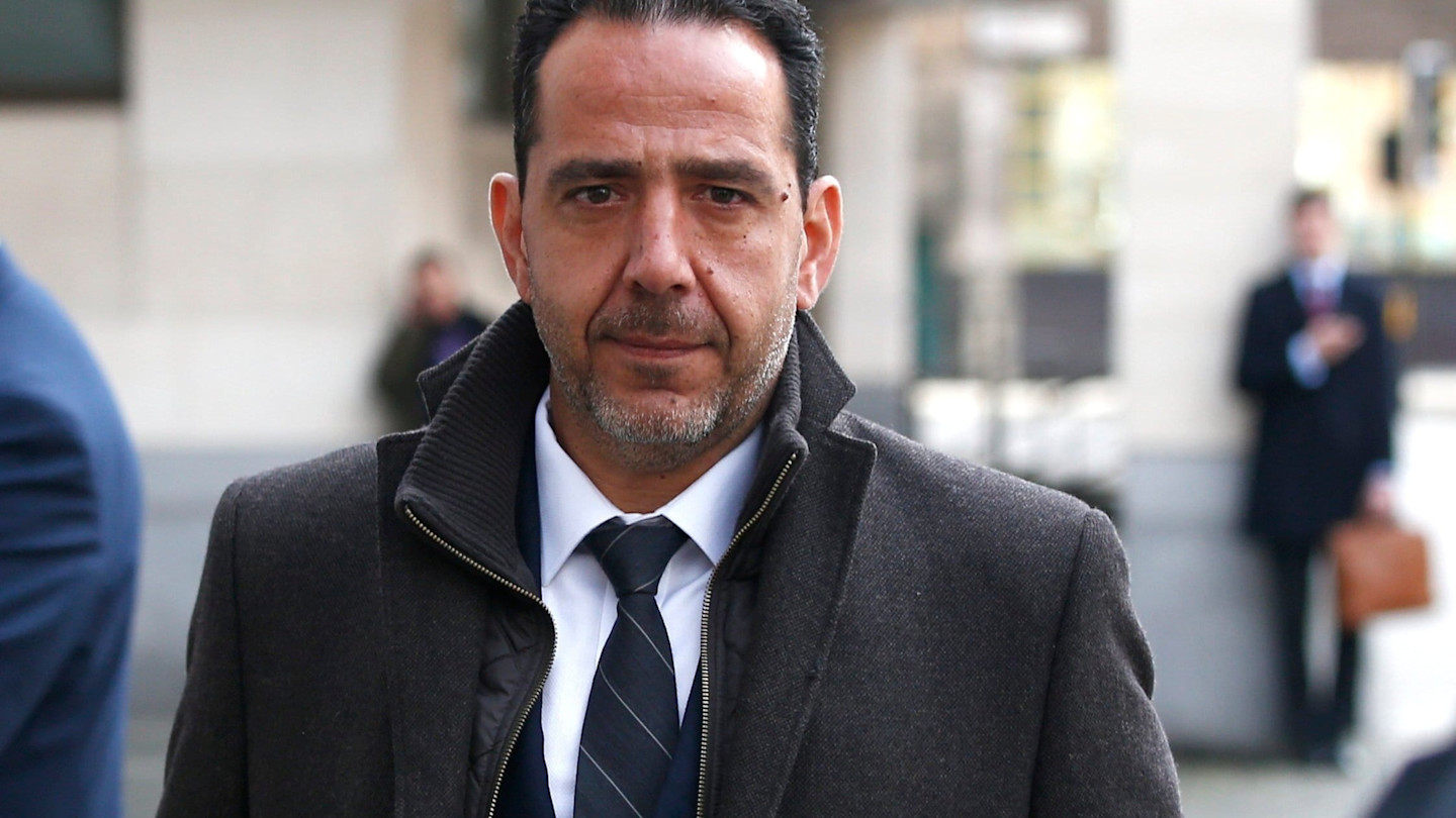 Christian Bittar leaves Westminster magistrates’ court wearing a dark coat and tie.