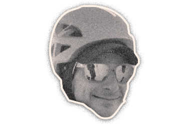 Black-and-white cut-out portrait of a man wearing a helmet and glasses