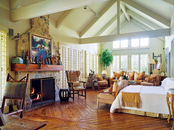 The main bedroom with its antique furniture and (on the mantelpiece) articulated hands