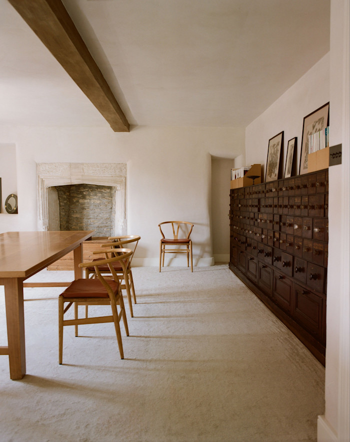 A Heal’s cherrywood table and Hans Wegner Wishbone dining chairs in the study