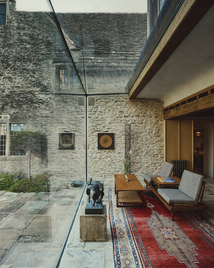 A sculpture by Laurence Edwards in the glass extension of Tamsin Wimhurst and Mike Muller’s Grade II*-listed manor house