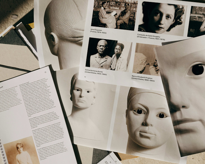Pages showing photographs of busts, portraits, and biographical notes of women artists, including Nancy Elizabeth Prophet.