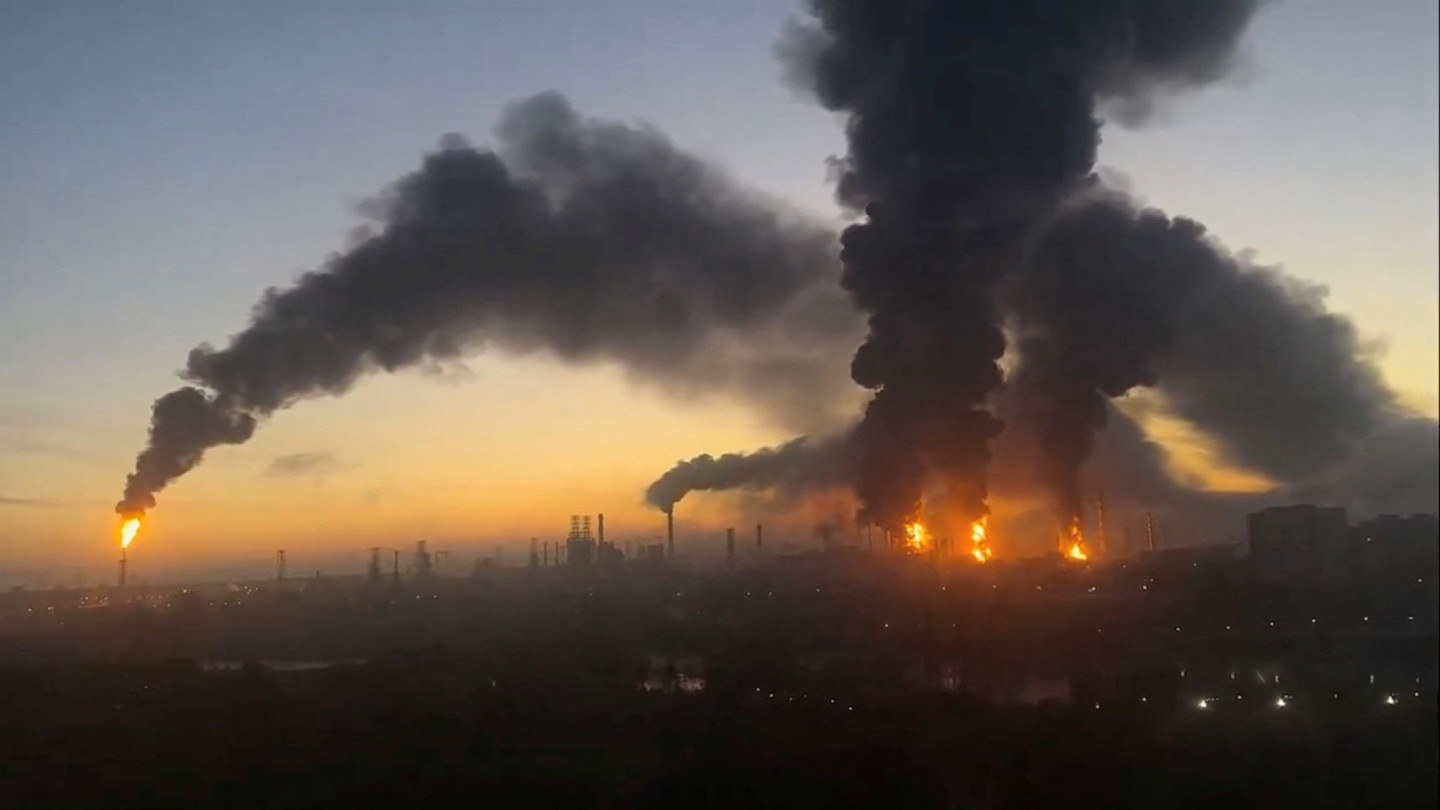 Thick black smoke and flames rise from multiple locations at a Russian oil refinery
