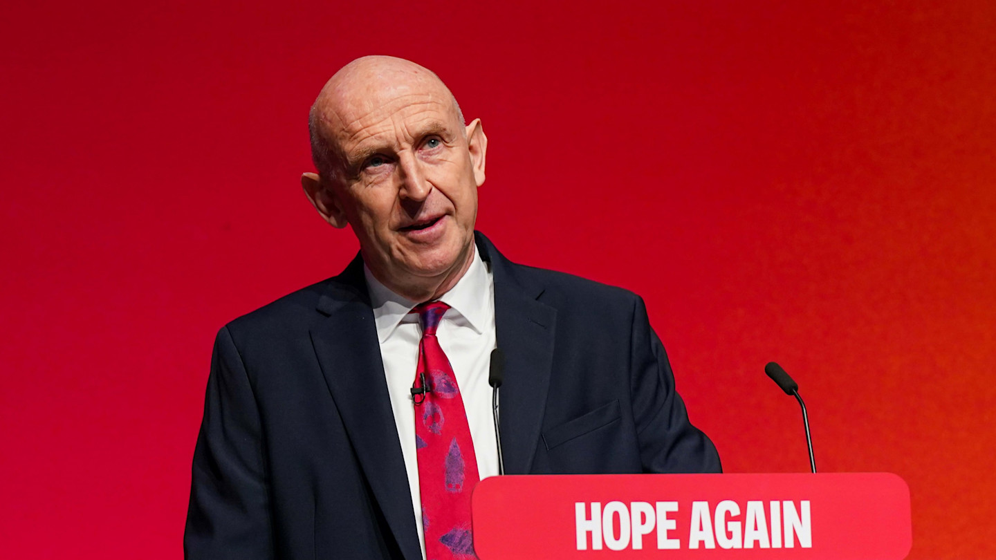 Chancellor John Healey speaks at a podium during the Labour party conference