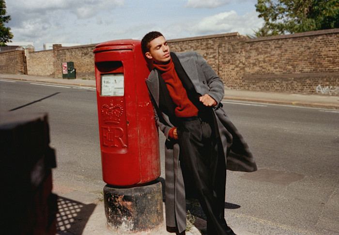 Dior wool and cashmere flannel coat, POA, and wool canvas suit, £2,700. Goldwin wool/recycled-polyester knit top, POA