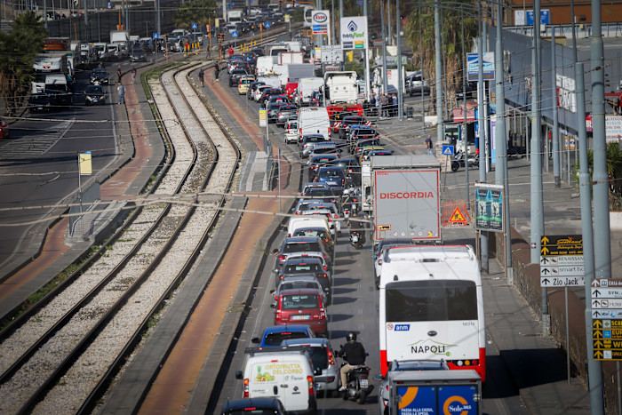 Traffic congestion with parked trucks, cars, and buses along a street during a truckers' protest over high fuel prices in Naples, Italy.